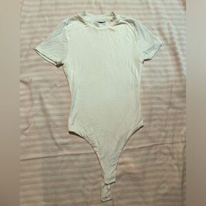 Naked wardrobe high neck body suit thong white